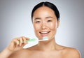 Brushing teeth, asian woman beauty and dental wellness, health and cleaning cosmetics on studio background. Happy young Royalty Free Stock Photo