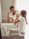 Brushing teeth, father learning and child in a bathroom at home in morning with dental cleaning. Oral hygiene, kids and