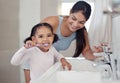Brushing teeth, girl or mother teaching learning child personal hygiene, dental care or healthcare in house or family