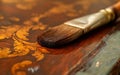 Brushing toning lacquer onto wood. Close-up. Applying shellac to wooden table, restoration work