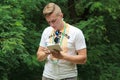 Brusilov, Ukraine - July 17, 2017: A sports guy in a white T-shirt is recording the results of the tests. Young coach Royalty Free Stock Photo