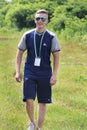 Brusilov, Ukraine - July 17, 2017: A sporty guy in Adidas clothes is walking along the field. Trainer. Leader