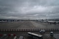 Brussels, Belgium - 2019-11-27: Airliners parked at the terminal in Brussels Airport, on a dark, rainy day