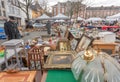 Customer of flea market and many old art, bargains and antique stuff in mess of vintage decor and retro details