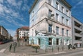 Street with cozy bars, restaurants and building with ocean ship painted on wall