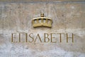 Name Elizabeth with a crown on the pedestal of the Statue of Queen Elisabeth I, in Brussels, Belgium.