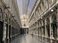 Brussels, Belgium, April 25, 2020 - one people walking alone inside the luxury glazed shopping arcade Les Galeries Royales Saint-