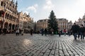 Brussels, Belgium - December 13, 2009: People walking near decorated Christmas Tree on the Grand Place square in Brussels, Belgium Royalty Free Stock Photo