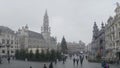 BRUSSELS, BELGIUM - DECEMBER 04, 2017: Pleople visit the Grand Place in Brussels on a bad weather day