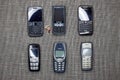 Brussels, Belgium - February 26, 2017 : A collection of old mobile phones including the iconic Nokia 3310, Nokia 1600, E71 and E72 Royalty Free Stock Photo