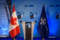 Flags of Canada and NATO, after press conference