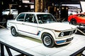 Vintage white iconic BMW 2002 Turbo 1973 Ginion Classics glossy and shiny old classic retro car at Brussels Motor Show Royalty Free Stock Photo