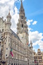 Brussels, Belgium - July 20, 2020: Tower of the city hall at the Grand place central square in the old town of Brussels Royalty Free Stock Photo