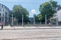 View of park and square of le Petit Sablon with sculptures on the fence