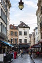 Brussels, Belgium, 10/14/2019: Narrow street with beautiful old houses in the European old town. Vertical Royalty Free Stock Photo