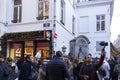 Large group of tourists taking photos at Manneken Pis