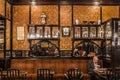 Brussels, Belgium : Old man reading a newspaper the cafe Le Cirio in Art Nouveau style