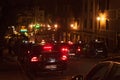 BRUSSELS, BELGIUM - SEPTEMBER 06, 2014: Night view of a black taxi cars parked on roadside in the historic part