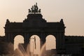 Brussels, Belgium, Triumphal Arch,Jubilee Park, Parc du Cinquantenaire with fountain in front at sunset. Royalty Free Stock Photo