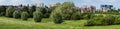 Extra large panoramic view over green meadows with the city buildings in the background. Brussels, Belgium