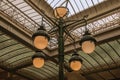 Art Nouveau lamp and glass ceiling in an old building, at Brussels.