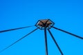 Brussels city center, Beglium - Hanging structur of a street lamp with diagonals over blue sky