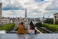 Brussels City Center, Brussels Capital Region - Belgium - Two teenage girlfriends having a chat, overviewing the city