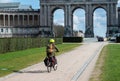 Brussels European Quarter, Belgium - Woman driving the bicycle in the Parc du Cinquentenaire