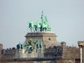 BRUSSELS - FEBRUARY 25: Tourists on top of the  centrepiece triumphal arch in Parc du Cinquantenaire Royalty Free Stock Photo