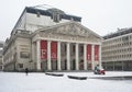 Brussels old town, Belgium - The Monnaie square and the opera hall covered with snow