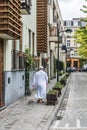 Brussels Old Town , Belgium - Moroccan man in traditional white Djellabah clothes walking through the Streets of Brussels Old