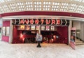 Brussels Old Town, Belgium - Young woman standing in front of the entrance of the Adventure vintage cinema