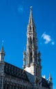 Brussels Old Town, Brussels Capital Region, Belgium - Gothical tower of the city hall over blue sky Royalty Free Stock Photo