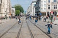 Brussels Old Town, Brussels Capital Region - Belgium - Adults and children walking and playing over the rue de la Regence Regency