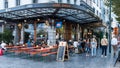 Brussels Old Town, Brussels Capital Region- Belgium -happy people walking and sitting on the terrace of cafe Bebo