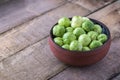 Brussels sprouts in ceramic bowl on rustic wooden table. Royalty Free Stock Photo