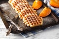 Brussels waffles on the old tray Royalty Free Stock Photo