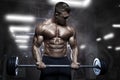 Brutal athletic muscular bodybuilder workout with barbell at gym Royalty Free Stock Photo