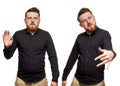 Brutal, attractive, bearded man poses in a black shirt, isolated on a white background Royalty Free Stock Photo