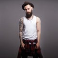 Brutal bearded boy with tattoo Royalty Free Stock Photo