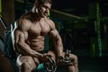 Brutal bodybuilder working out in gym with chain Royalty Free Stock Photo
