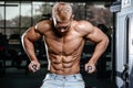 Brutal caucasian handsome fitness men on diet training chest pumping