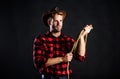 Brutal and confident. Western life. Man unshaven cowboy black background. Man wearing hat hold rope. Lasso tool of Royalty Free Stock Photo