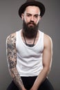 Brutal hipster boy with tattoo