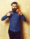 Brutal hipster holding tropical alcoholic fresh cocktail