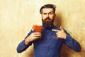 Brutal hipster holding tropical alcoholic fresh cocktail