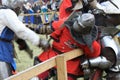 Brutal Knights battle in iron armor with bladed weapons