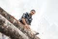 Brutal lumberjack cuts forest with sharp ax