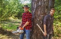 Brutal lumberjacks. Cutting wood. Brutality and masculinity. Lumberjack style. Man woodcutter with axe. Man with axe.