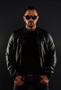 Brutal macho in leather jacket. Bearded man in fashion sunglasses. Mens sexuality and attraction. Fashion model in